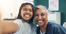 Bilingual doctor speaking Spanish with patient in Texas clinic