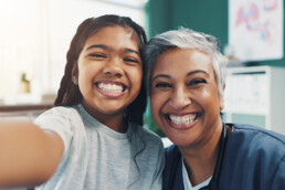 Bilingual doctor speaking Spanish with patient in Texas clinic